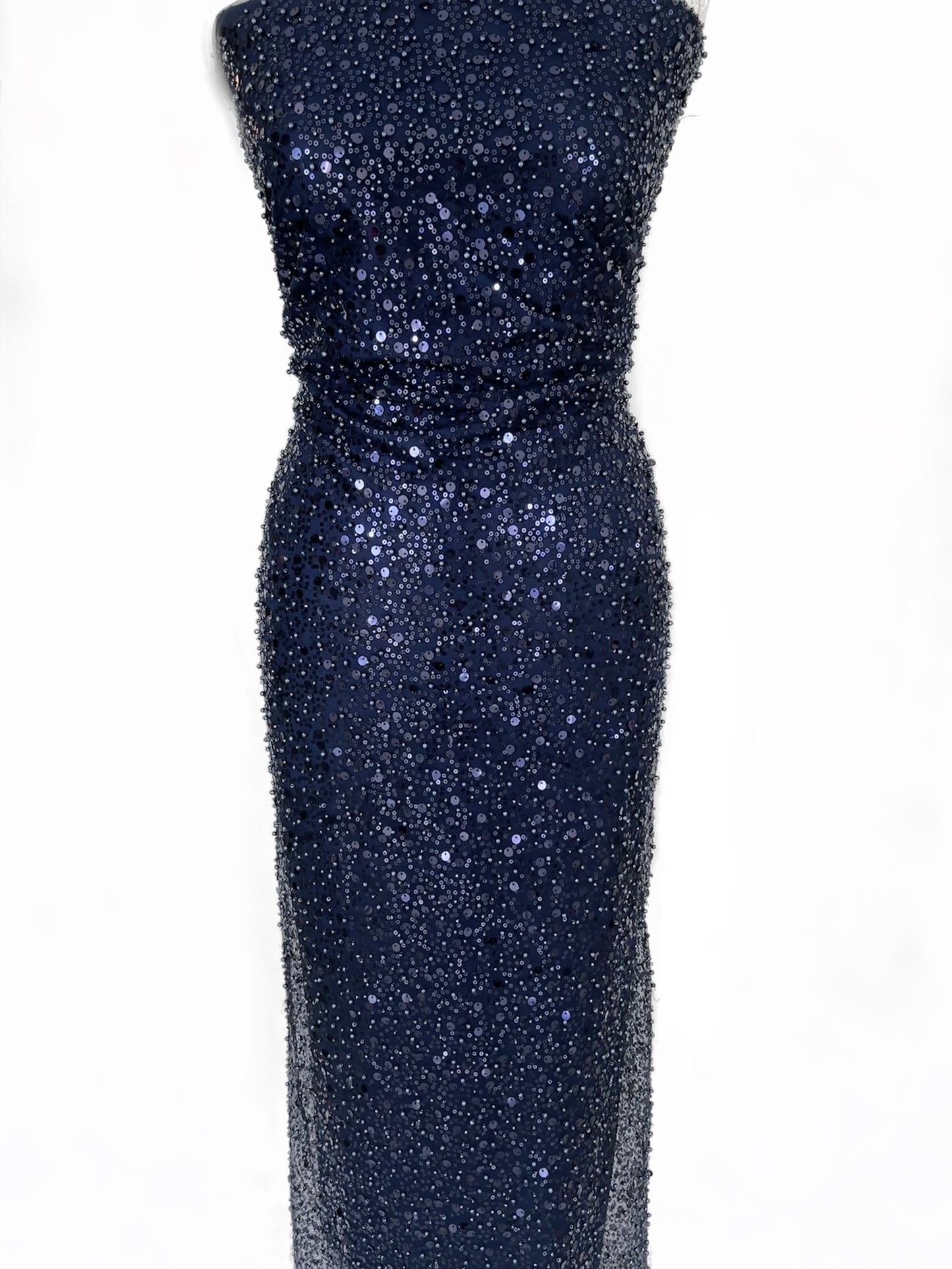 Inspired by Nyx the goddess of the night, feel empowered walking into any room. This stunning midnight blue lightweight mesh is covered elegantly in beads and sequins perfect for your special occasion. You will receive 6 yards of fabric (approximately 5.4 meters, lining not included) Small samples are available for UK shipping only. Free worldwide shipping.